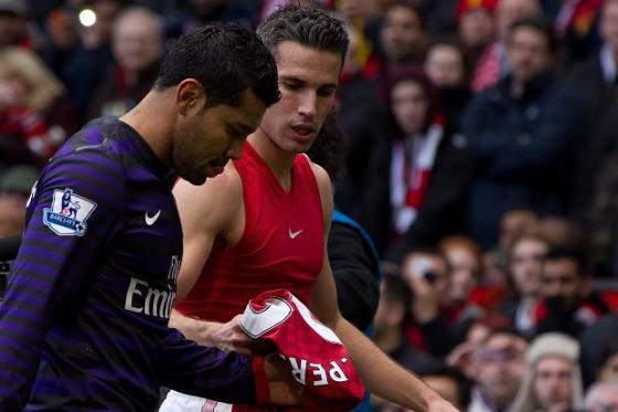 Van Persie hands Santos his Arsenal career.